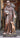wood carved statue of st francis holding a rabbit. bird sitting on shoulder. deer standing by his side